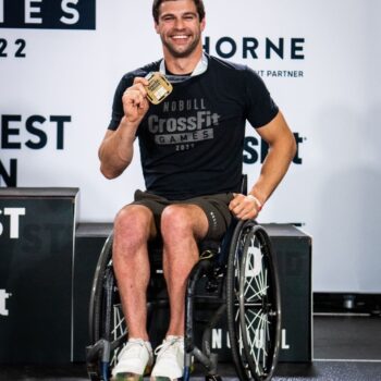 Tom Miazga showing his 1st place CrossFit Games medal