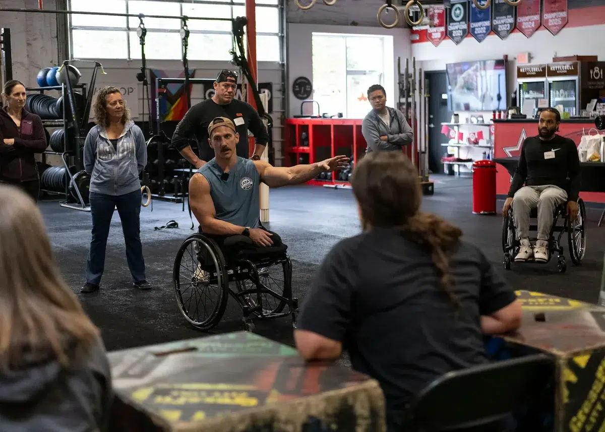 ATA seminar staff member Mike Egan coaches trainers through a dip progression