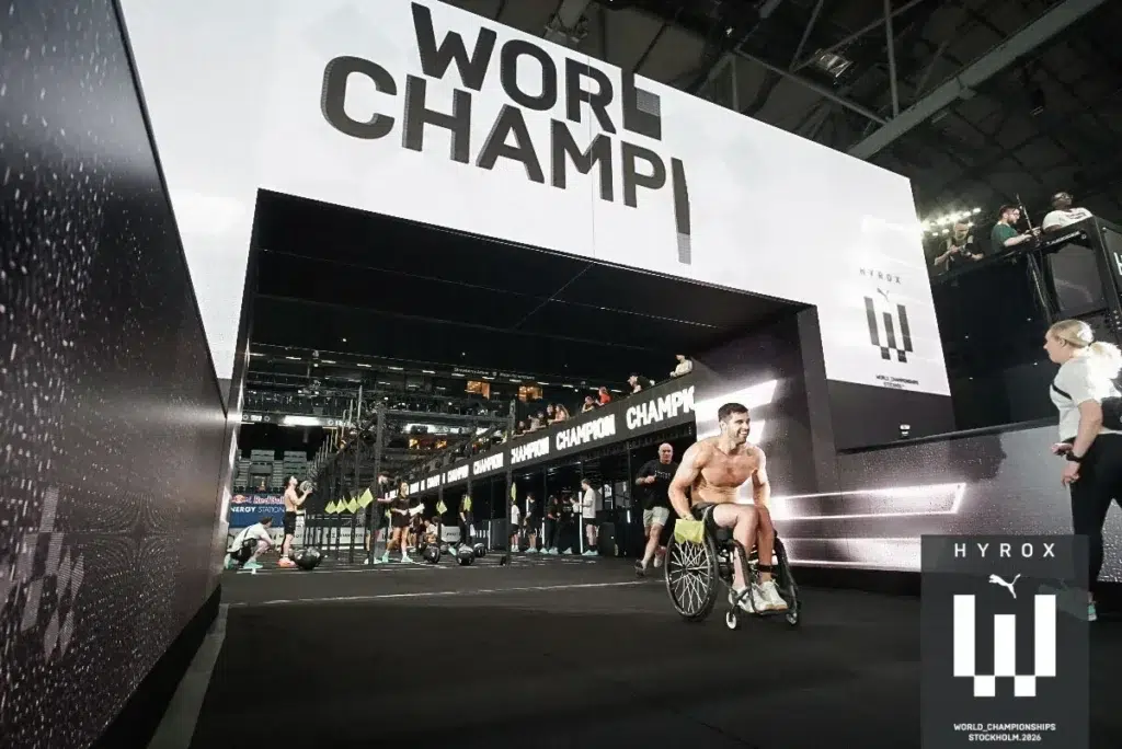 Tom Miazga crosses the finish line in his racing wheelchair at the 2026 HYROX World Championships